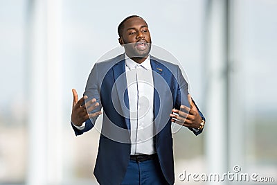 Man in formal wear passionatly speaking. Stock Photo