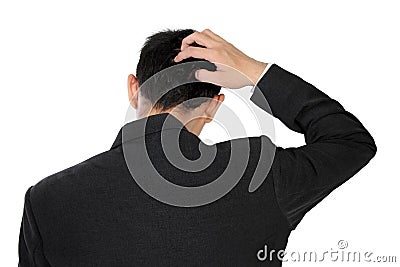 A man in formal wear scratching his head in confusion, isolated on white Stock Photo