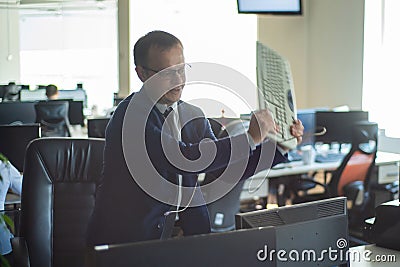 A man freaks out and gets depressed from a mistake and breaks the keyboard on the monitor. The male manager is angry and Stock Photo