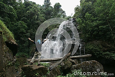 Man freedom in natural water fall in Jungle Stock Photo