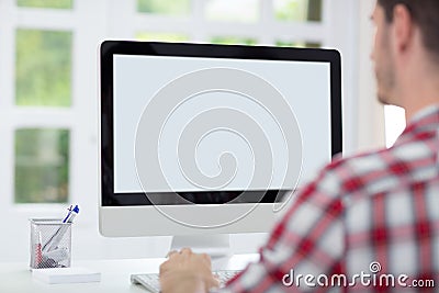 Man in front of computer screen Stock Photo