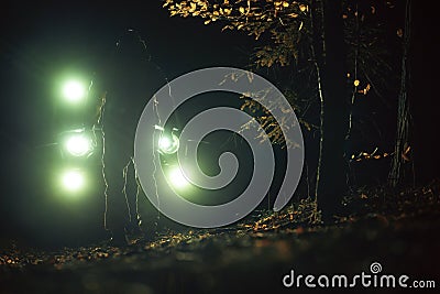 A Man in Front of His Four Wheeler During Night Hours Stock Photo