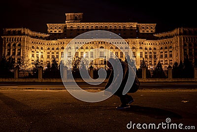 Man in front of Palace of Parliament, Bucharest, Romania Editorial Stock Photo