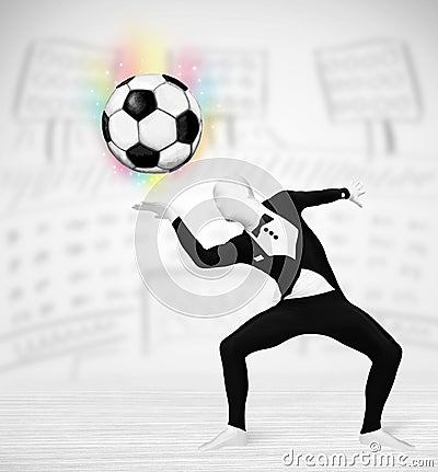 Man in full body suit holdig soccer ball Stock Photo