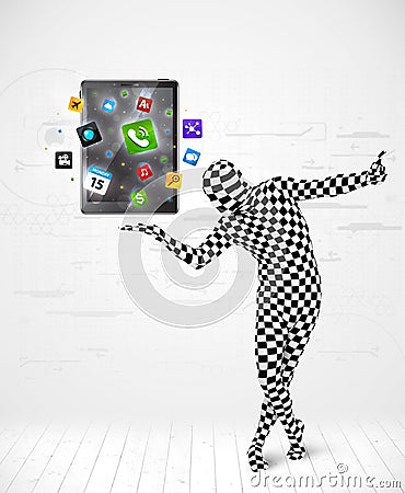 Man in full body suit holdig tablet pc Stock Photo