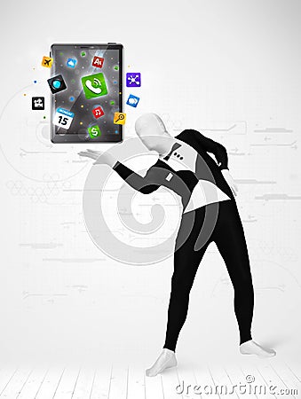 Man in full body suit holdig tablet pc Stock Photo