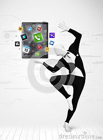 Man in full body suit holdig tablet pc Stock Photo