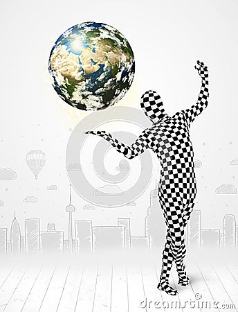 Man in full body suit holding planet earth Stock Photo