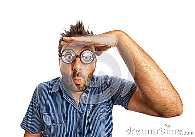 Man with funny expression and thick glasses looking far away. Stock Photo