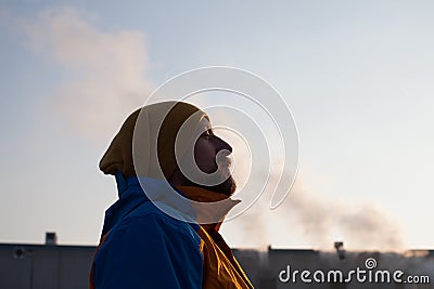 Man gasping for air in polluted city Stock Photo