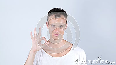 man gesturing OK sign on white background Stock Photo