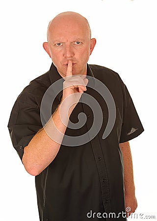 Man gesturing for quiet Stock Photo