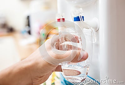 Man getting a cold, refreshing drink Stock Photo