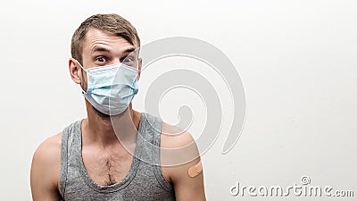 Man getting covid vaccinated. Person wearing face mask. Coronavirus pandemic Stock Photo