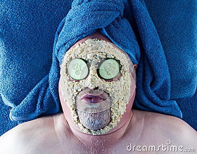 Man Getting Facial With Silly Facial Expression Stock Photo
