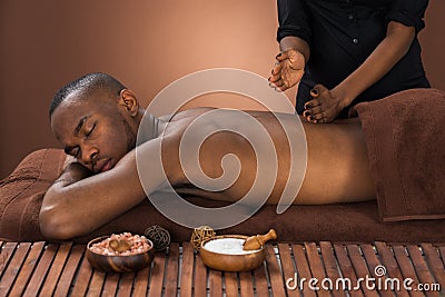 Man Getting Massage In Spa Stock Photo