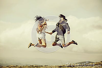 Man and girl jump high Stock Photo