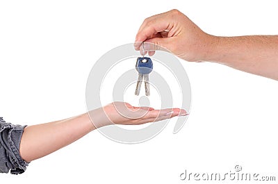 A man gives the keys to the lock of a woman close-up on a white background. male and female palms with keys Stock Photo