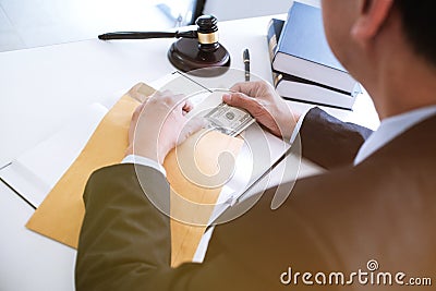 Man giving bribe money in envelope businessmen corruption Stock Photo