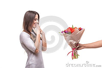 Man giving a bunch of flowers and surprised woman isolated Stock Photo