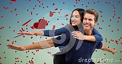 Man giving piggyback ride to woman Stock Photo