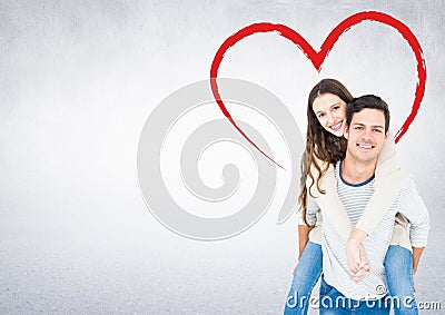 Man giving a piggyback ride to woman Stock Photo