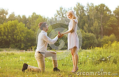 Man giving a ring woman, love, couple, date, wedding - concept Stock Photo