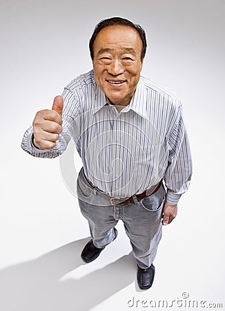 Man giving thumbs up gesture Stock Photo