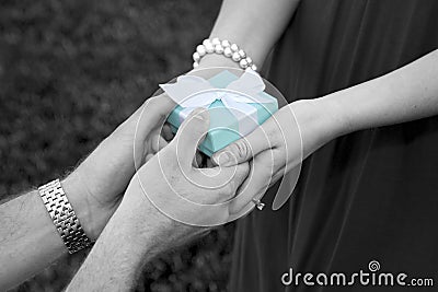 Man Giving Woman an Gift Box Stock Photo