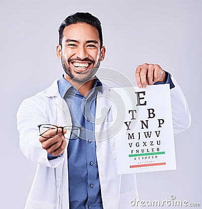 Man, glasses and eye chart of ophthalmologist in portrait at studio isolated on white background. Face, spectacles and Stock Photo