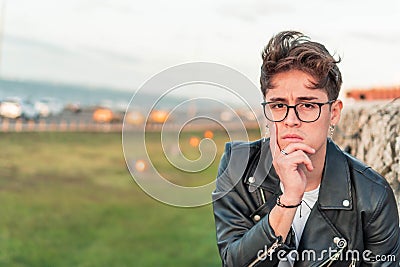 Man with glasses, looking at the camera, with expression of forgetfulness, confusion and making mistakes Stock Photo