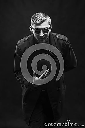 A man in glasses takes off his hat and reports bad news, a black and white frame Stock Photo