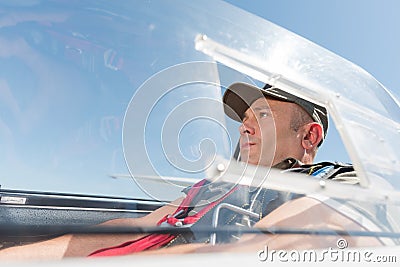 Man in glider cockpit Stock Photo