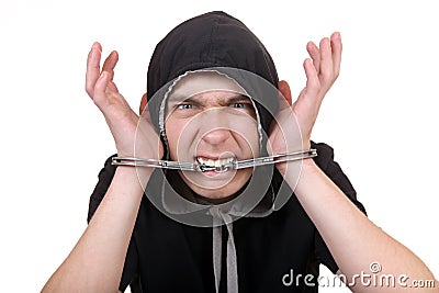 Man Gnaw a Handcuffs Stock Photo