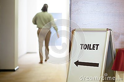 Man going to toilet Stock Photo