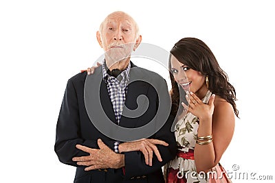 Man with gold-digger companion or wife Stock Photo