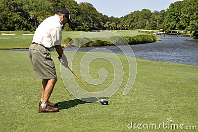 Man golfing Stock Photo