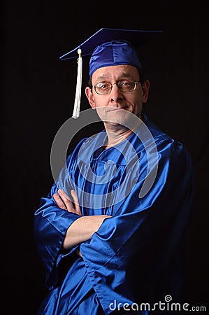 Man With Graduation Gown and Cap Stock Photo