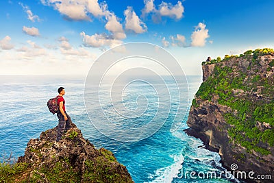 Man greeting nature on the top of mountain Stock Photo