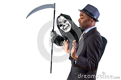 Man in Grim Reaper Ghost Costume Playing a Prank on Halloween Stock Photo