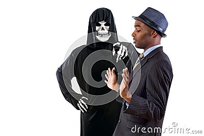 Man in Grim Reaper Ghost Costume Playing a Prank on Halloween Stock Photo