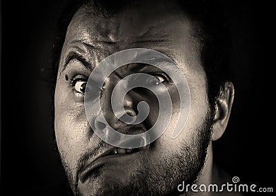 Man with grimace Stock Photo