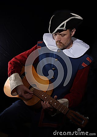 Man with a guitar (The troubadour), Stock Photo