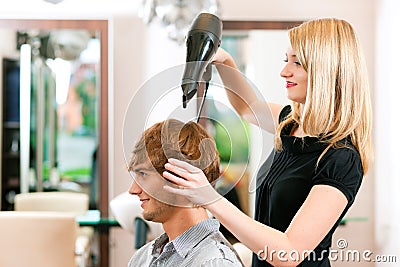 Man at the hairdresser Stock Photo