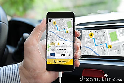 Man hand in car holding phone with application call taxi Stock Photo