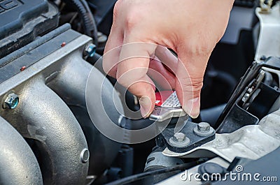 Man hand checking level of coolant car engine. Check and maintenance the coolant in car with yourself Stock Photo
