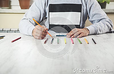 Man hand color pencils Stock Photo