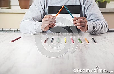 Man hand color pencils Stock Photo