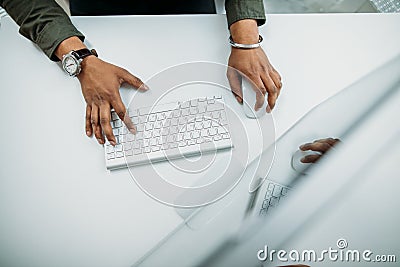 Man hand on computer keyboard on table top view Stock Photo