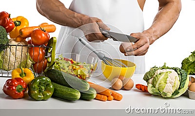 Man hand cook make omelette, beating whisk eggs, on kitchen Stock Photo